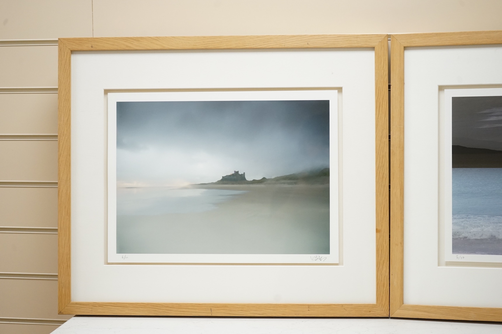 Valda Bailey (Contemporary), Seascape and coastline view, signed and numbered in pencil, pair of photographic prints, 33 x 44cm